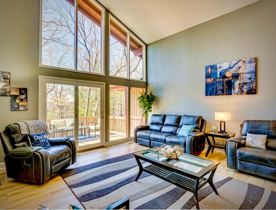 massive sliding door leading to the deck grill and overlooking the lake.