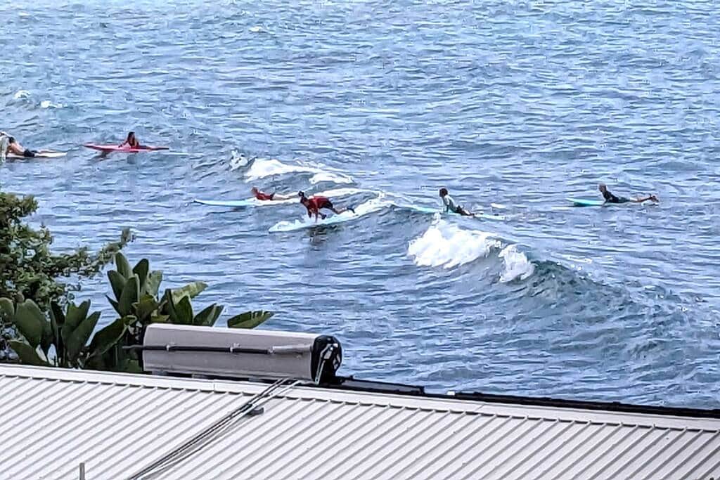 Photo taken from Lanai and zoomed in to view of the surf area. 
