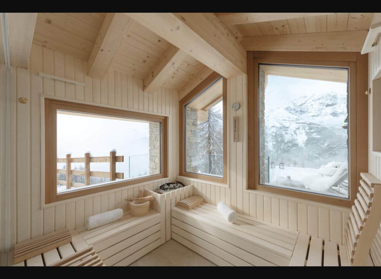 Finnish sauna with panoramic windows over the Alps