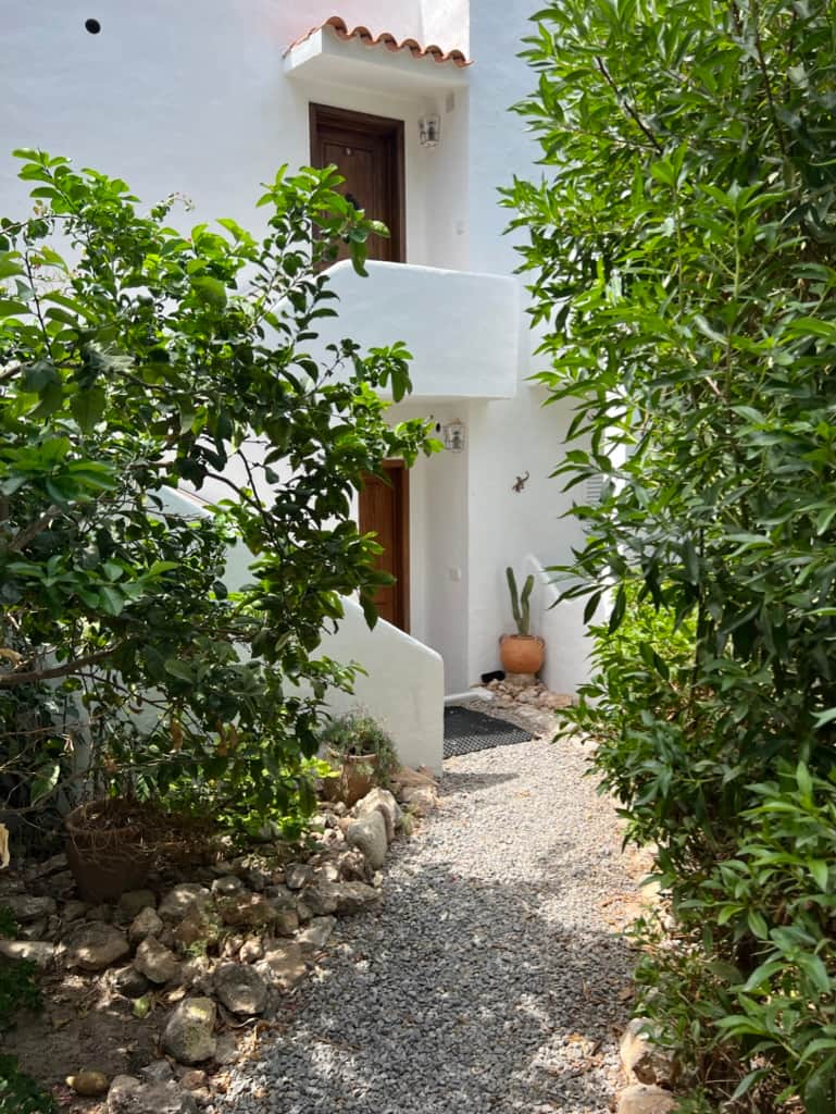 Entrance to Ibiza Seaview Apartment surrounded by greenery in Cala Vadella