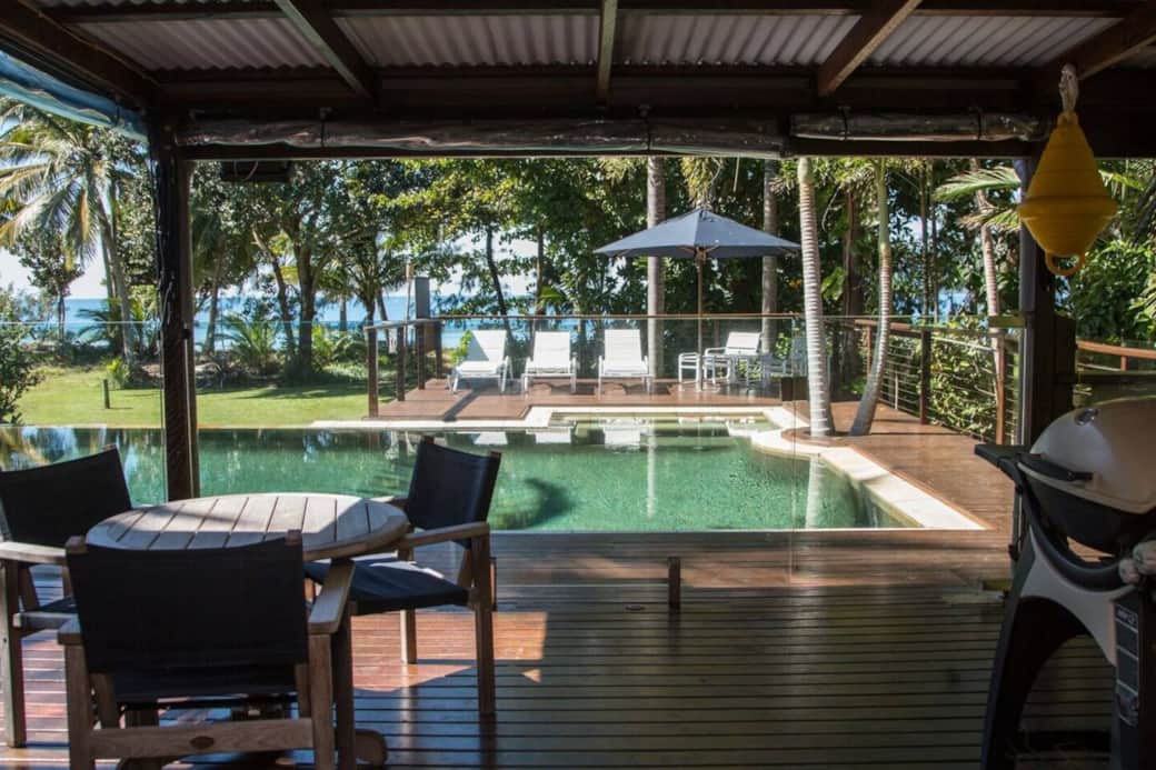 The Beach Cottage - Seating area on patio with BBQ