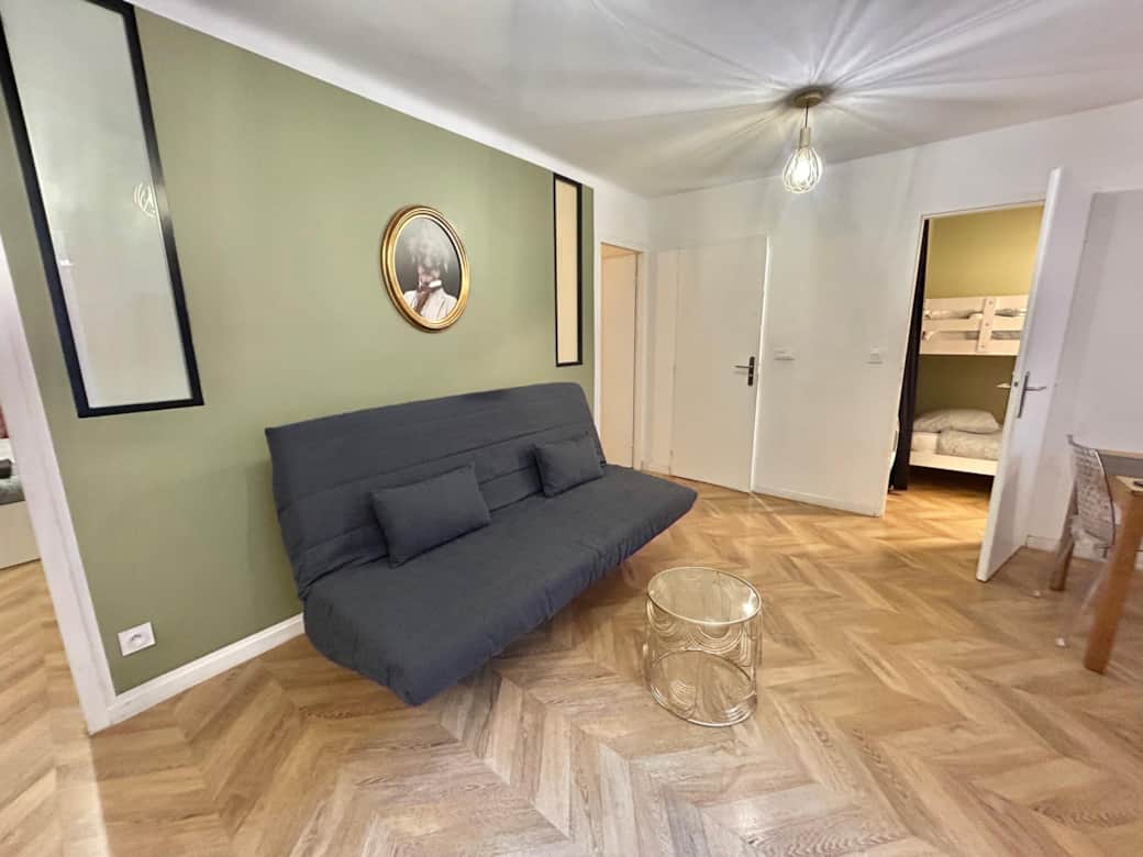 living room, TV, convertible sofa, table