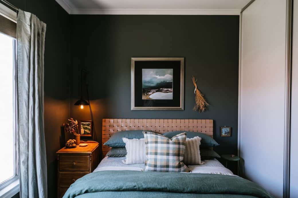 Block out blinds, layers of linen and moody shades in the bedroom.