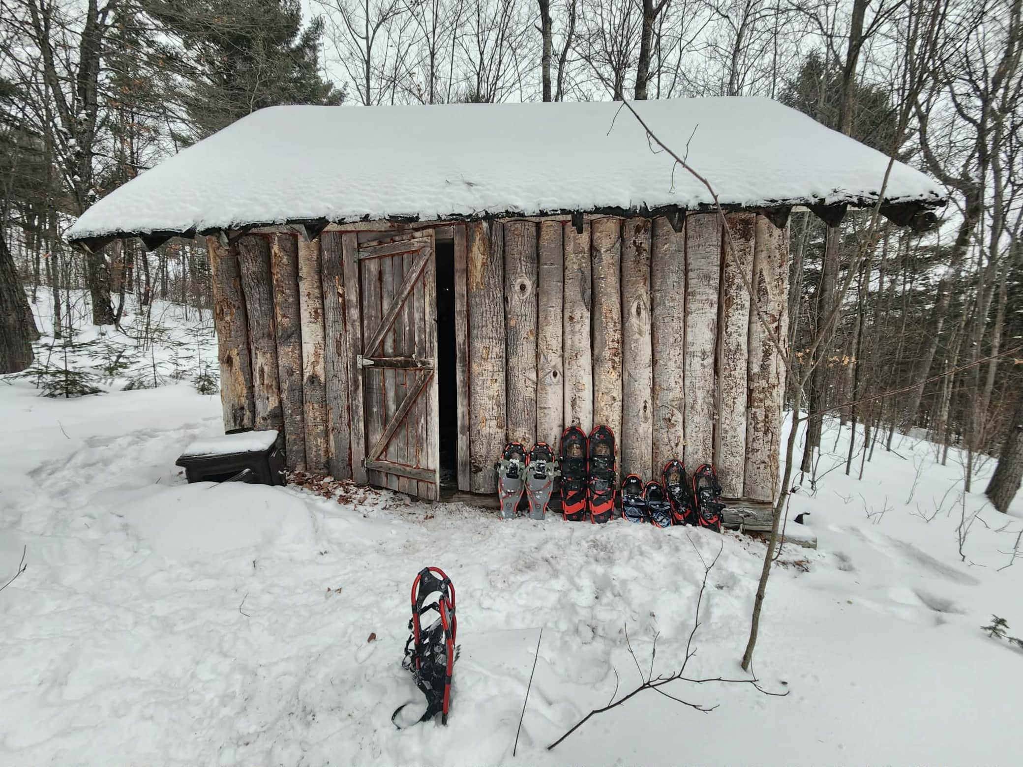 Our guided snow-shoe excursion leads you here - a cabin hidden deep in the woods on private land