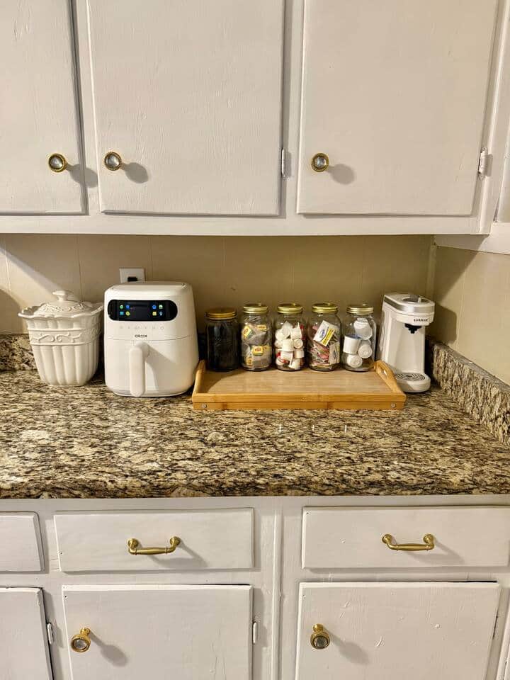 Air fryer & Coffee station fully stocked with k-cup pods, sugar packets, creamer pods, coffee stir straws, & tea bags for tea lovers!