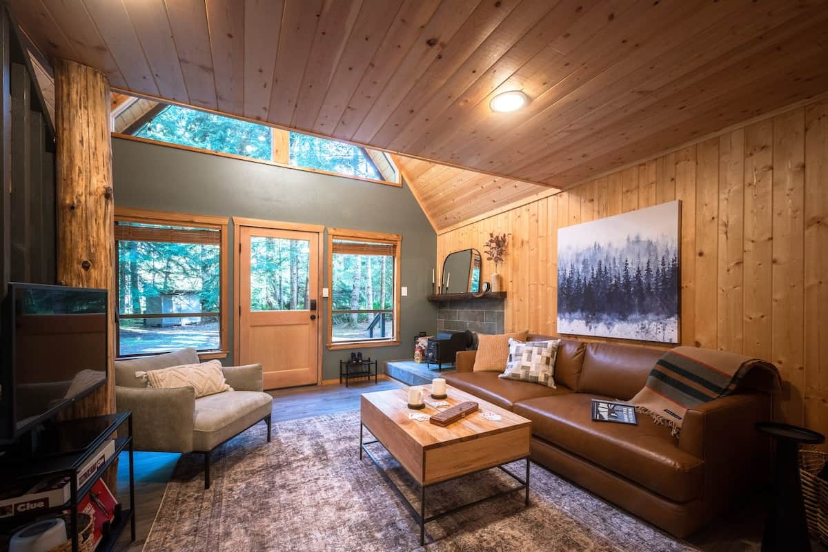 The living room is equipped with classic games, puzzles, a Roku TV, record player and a wood-burning stove.