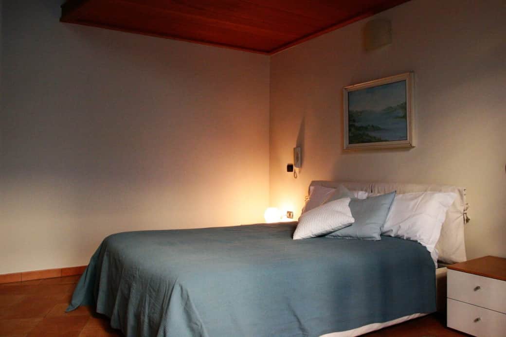 Another view of the main bedroom. In front of the bed there is large wardrobe where clothes and suitcases may be stored