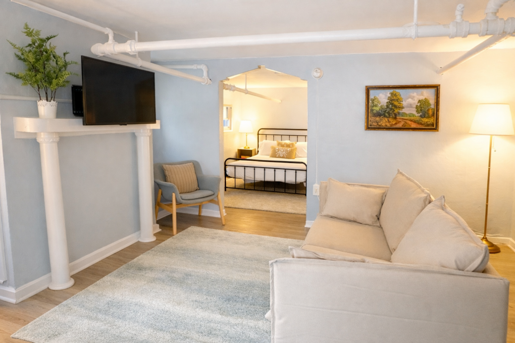 A stylish, cozy living room where you can feel the building’s vintage charm