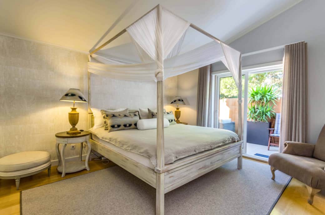 Suite 1 with super king-size canopy bed and private rooftop exit