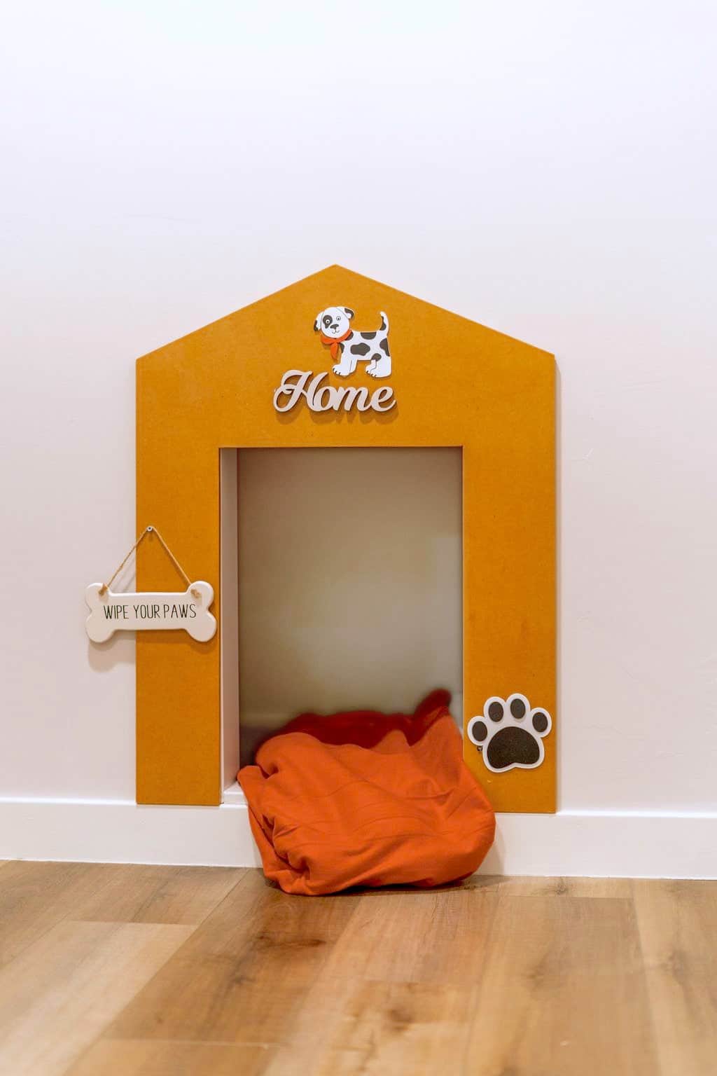 Pets are welcome! A cozy dog-bedroom nook with an orange cushion sits beside the office.