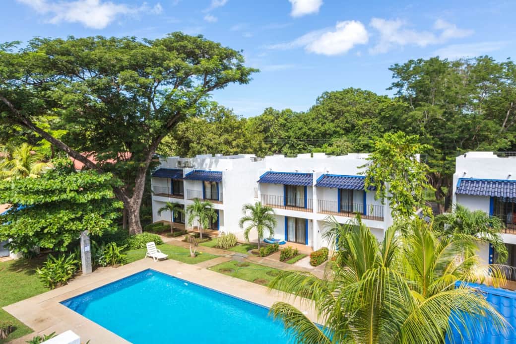 View from rooftop the beach is just over the ridge of trees! 
