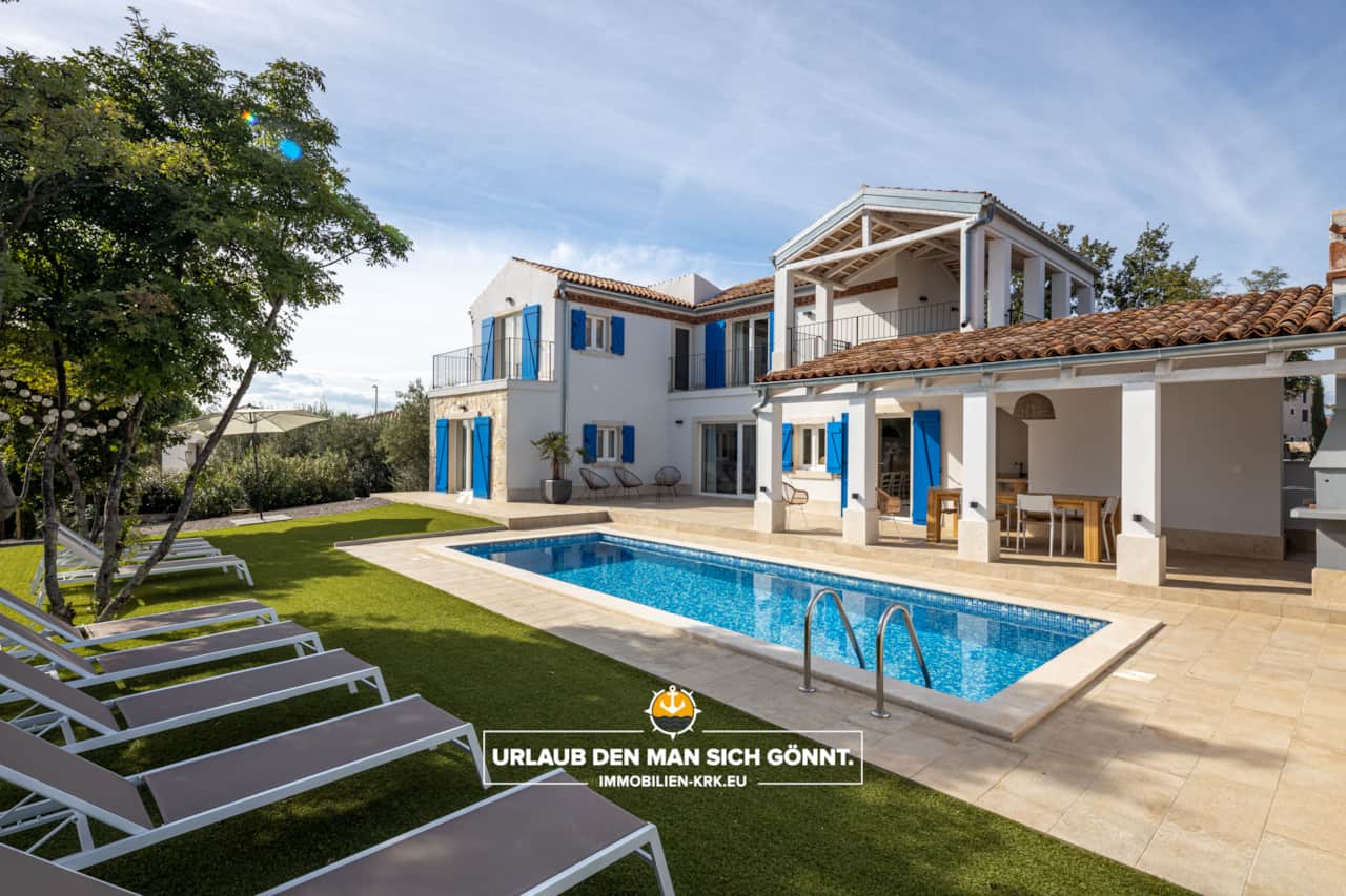 Pool area and villa