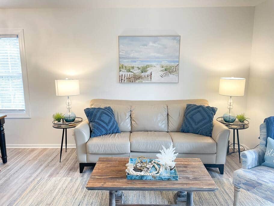 Main floor living room with lower balcony access.
