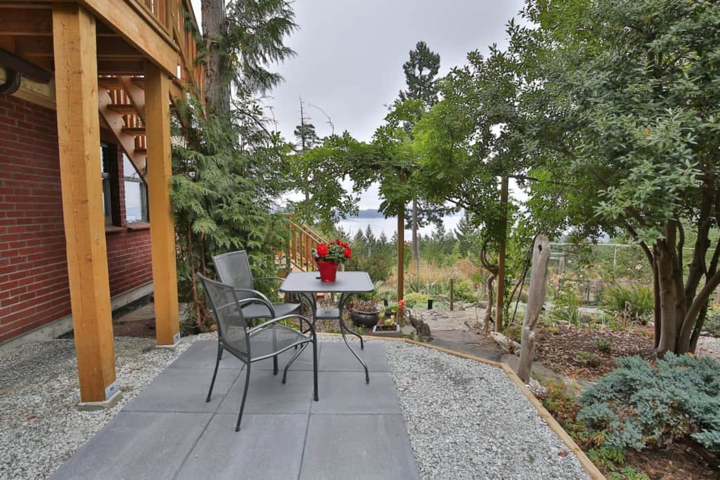 Enjoy your morning coffee at the garden's edge taking in the ocean view from your patio