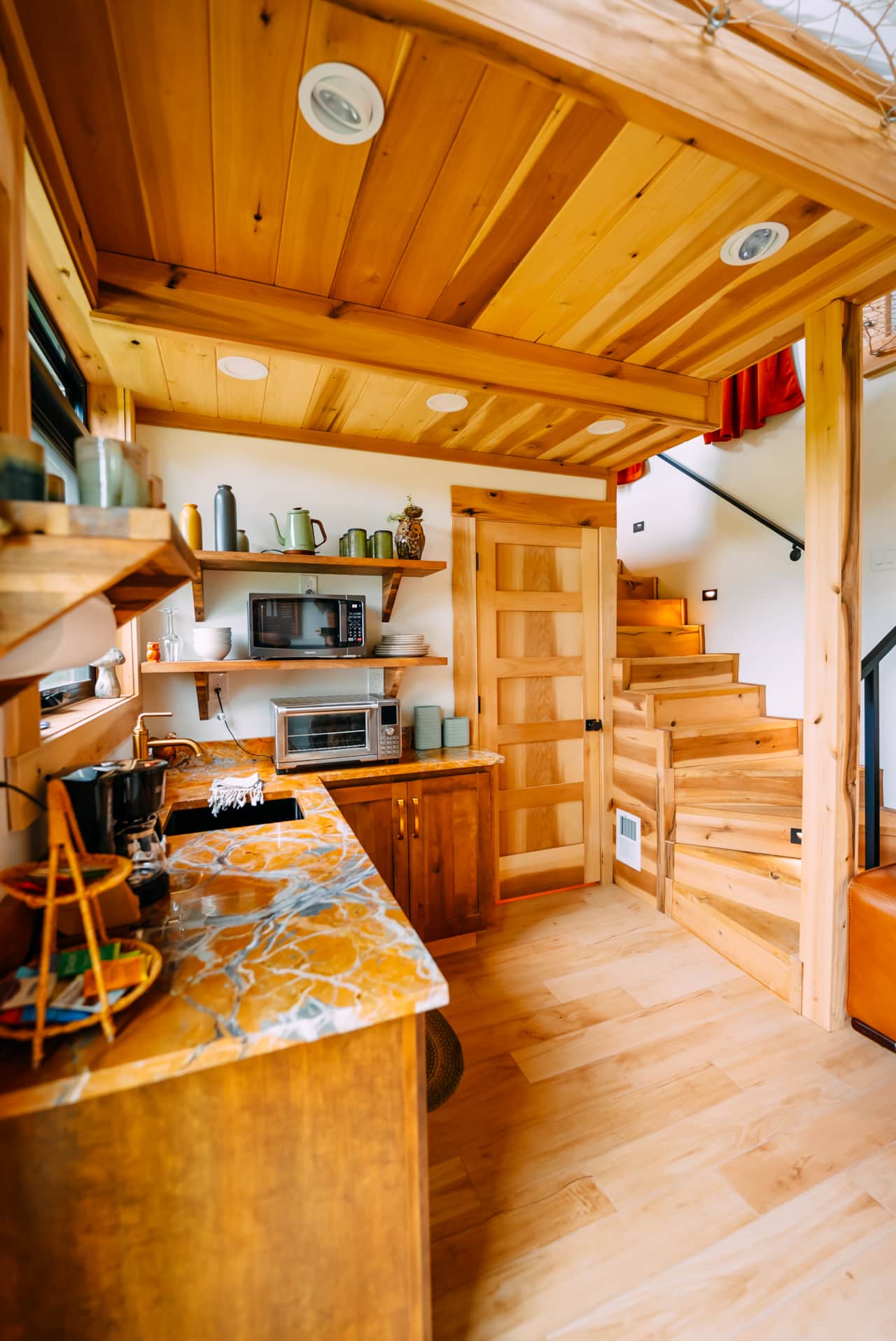 Kitchen area includes microwave, toaster oven, coffee pot, toaster, and hot plate