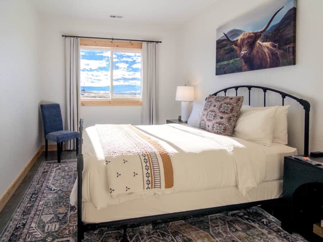 Wake up to stunning views of the Big Horn Mountains. This cozy room features a plush bed and a serene atmosphere for a restful night.