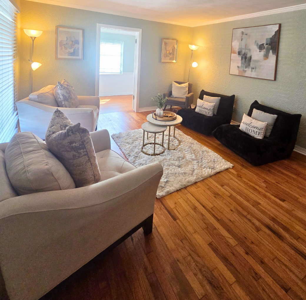 Bright and cozy living room with sofas, armchair, and decor pillows. Lakeland, FL Bright and cozy living room with sofas, armchair, and decor pillows. Lakeland, FL