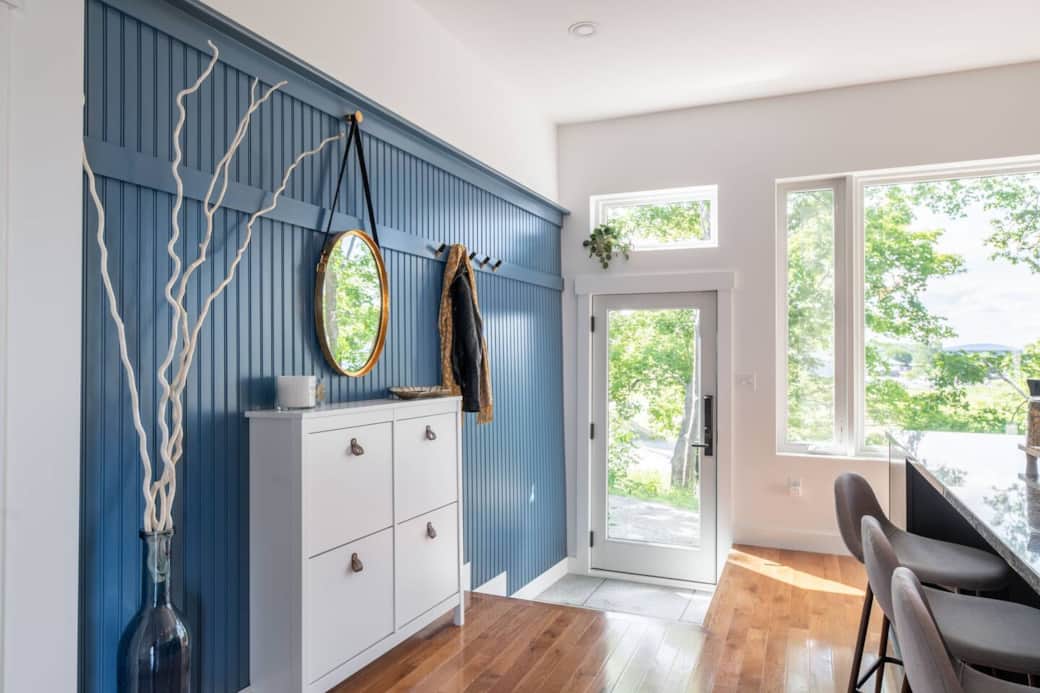 The gorgeous entryway has plenty of space for shoes and coats. (There are 2 steps outside and 2 steps inside to enter the house)