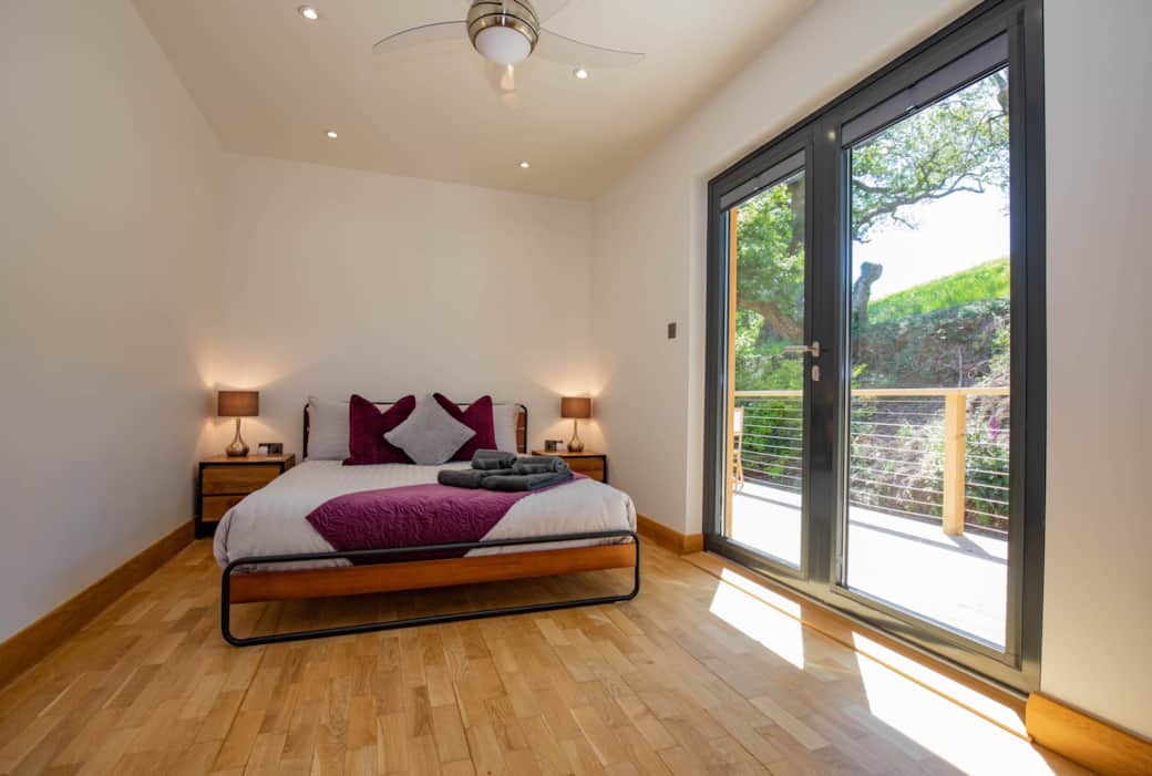 Bedroom 2. King Size opening onto large sunlit balcony 