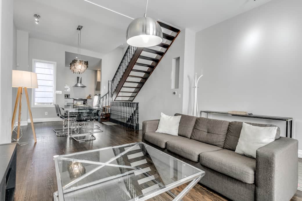 Illuminated and spacious living room in a Toronto high-end short-term rental.
