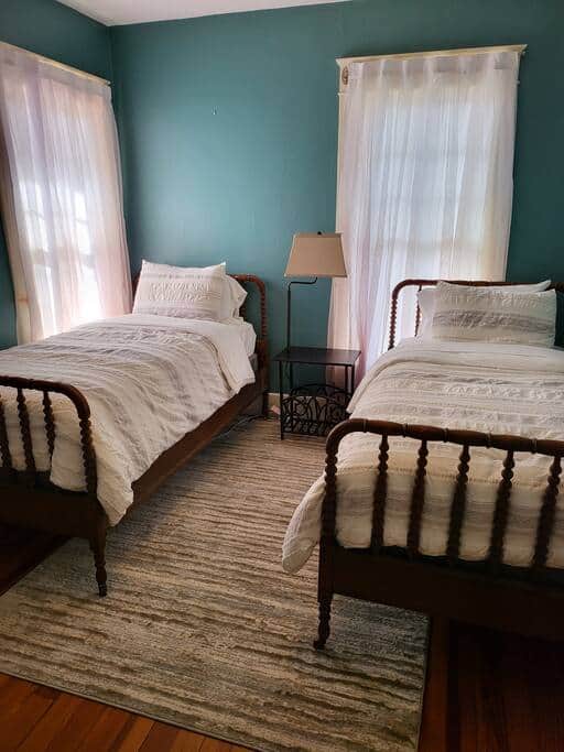 Bedroom 1. Two twin size beds and dresser.