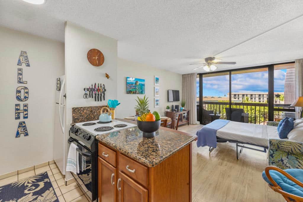 Stove/oven, full size refrigerator, stocked shelves for cooking.