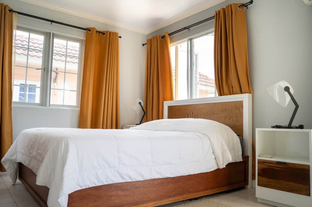 The bedroom — plush king bed, soft drapes, restful nights The bedroom — plush king bed, soft drapes, restful nights