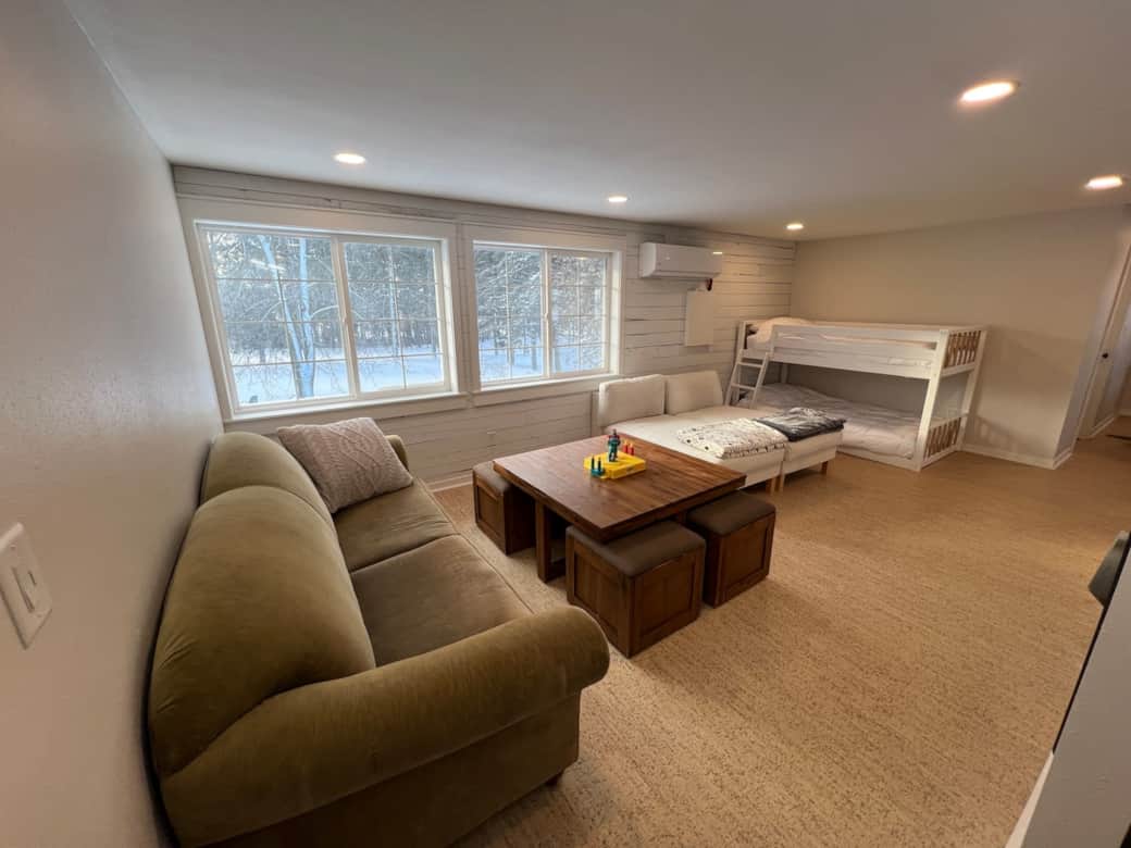 Game room in the loft with large windows, plenty of seating