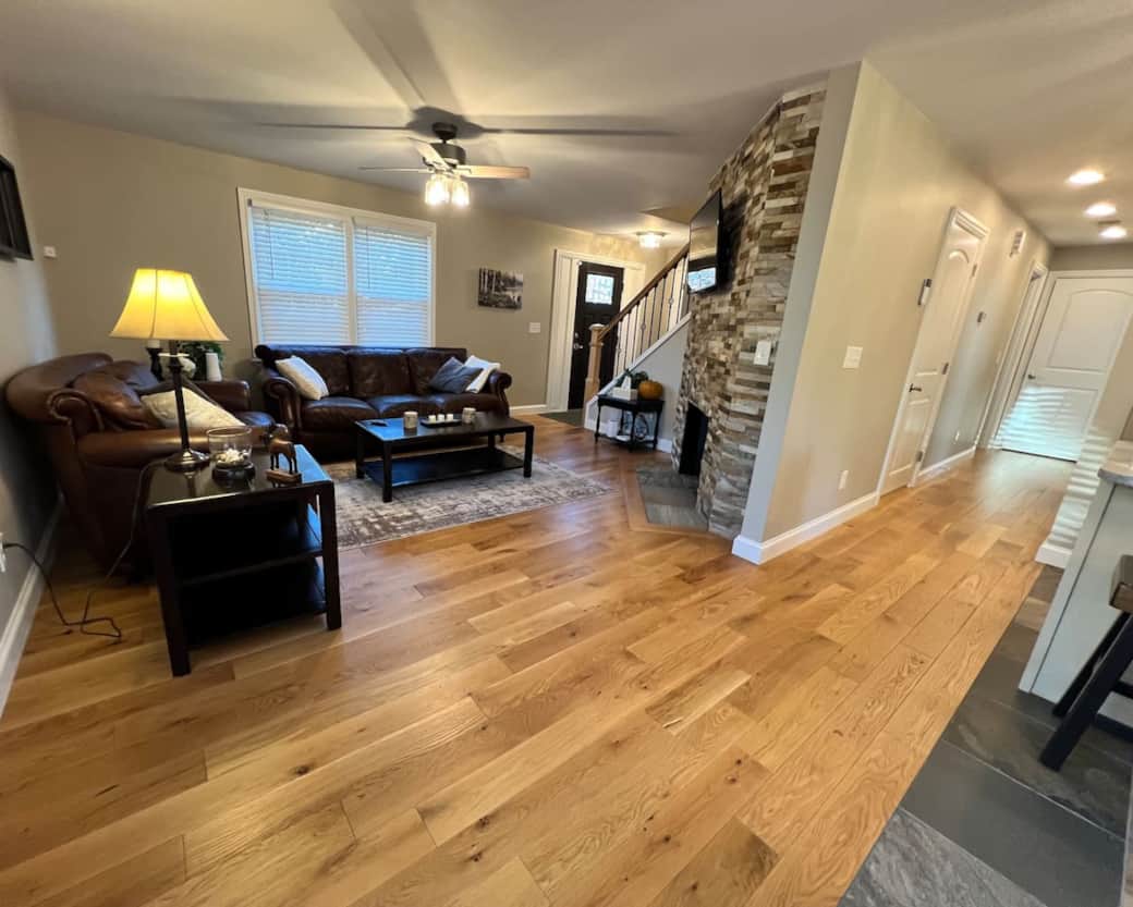 Living room, dining area, kitchen and view of hallway to bedrooms on main floor.
