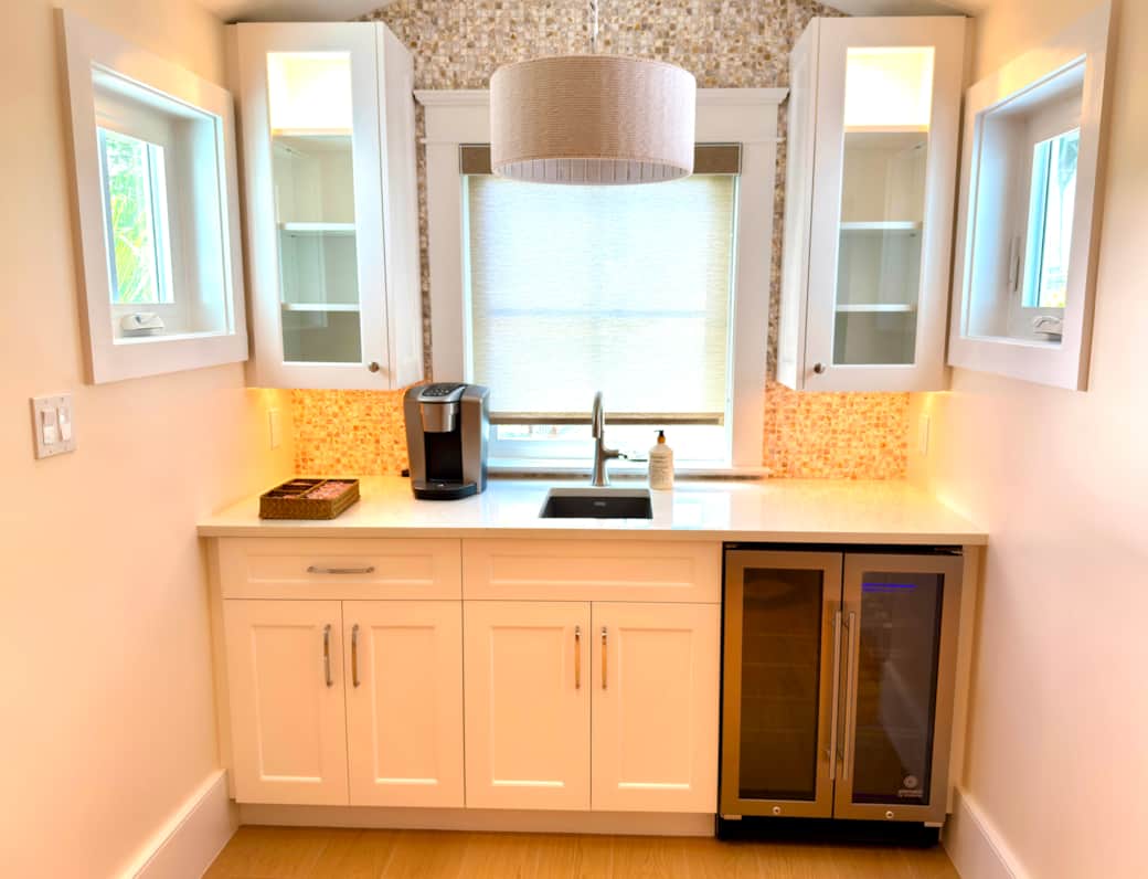 Upstairs wet bar with sink, Keurig, and mini fridge/wine cooler for added convenience.