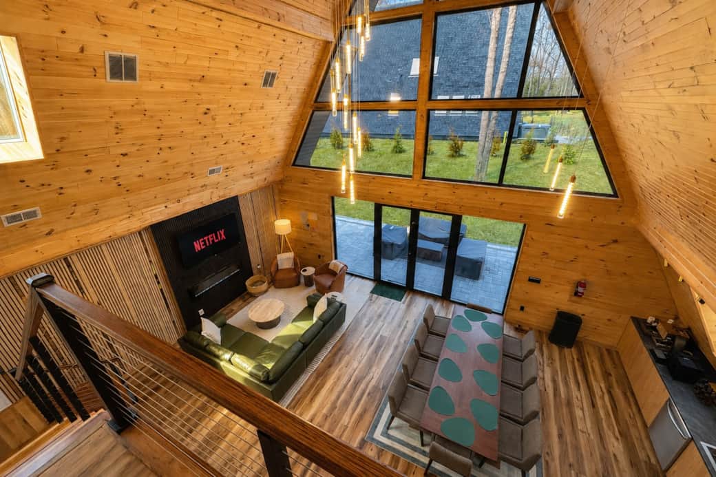 Living Room: Bright, airy space featuring stunning A-frame design and modern decor.