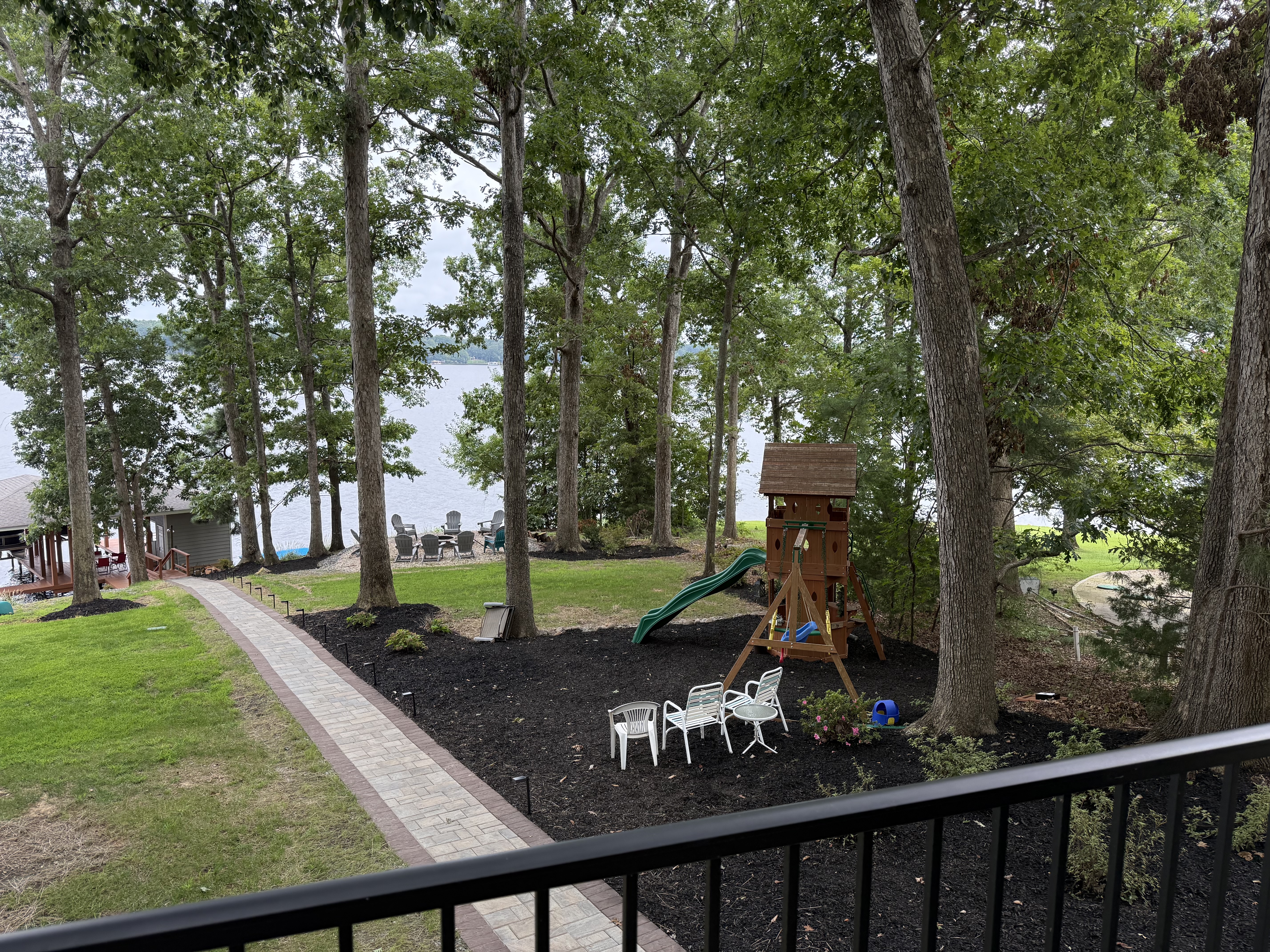Playground is now mulchec and a new hardscape pathway is in from the house to the lake