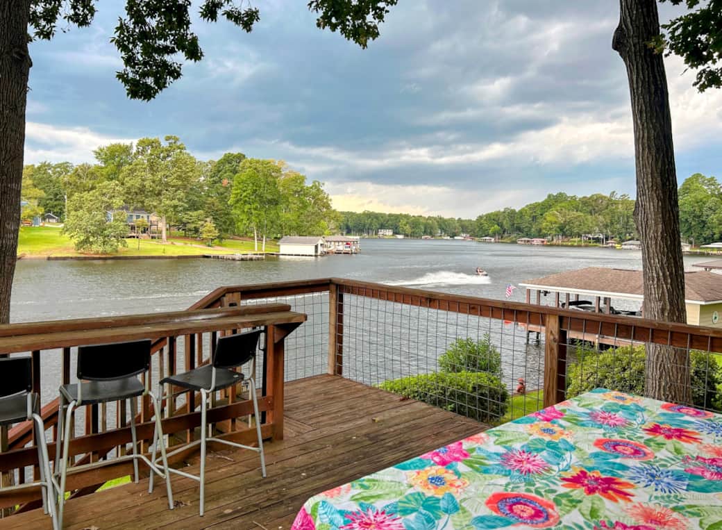 Outside dining on porch with expansive lake views