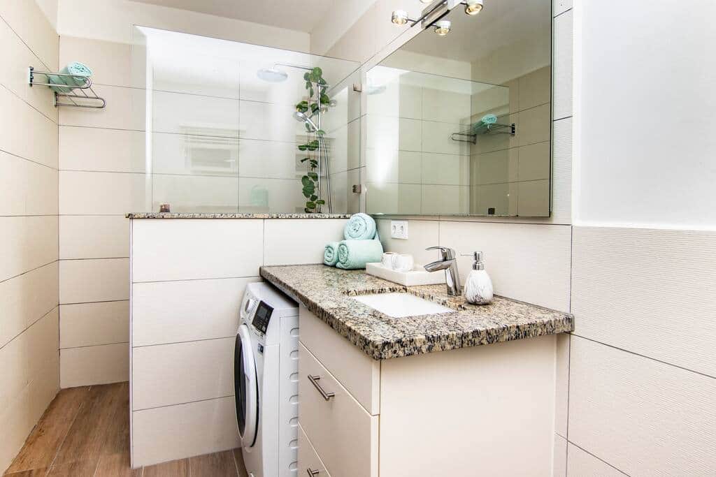Bathroom with washer-dryer (8kg) and rain shower.