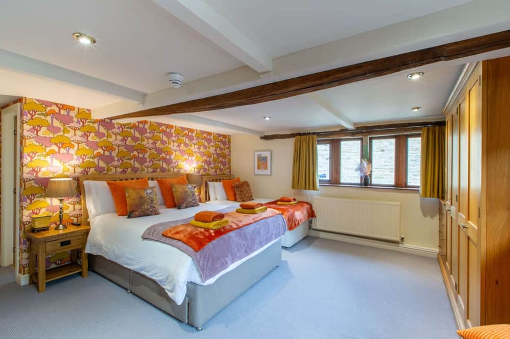 Large master bedroom with lovely views over the fields at the front of the  house.  It has a king-size bed, a single bed & loads of room to fit an extra guest bed.  It has a large ensuite bathroom with bath, separate shower cubicle, basin & toilet.