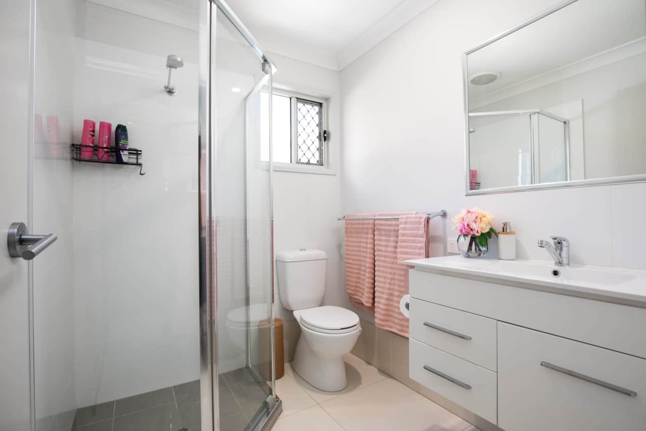 Bathroom: Stylish bathroom with walk-in shower, vanity, and clean finishes 