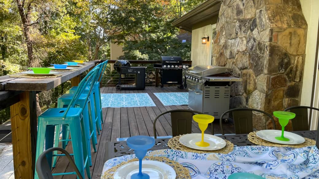 Main level grilling deck features charcoal grill, gas grill & gas griddle