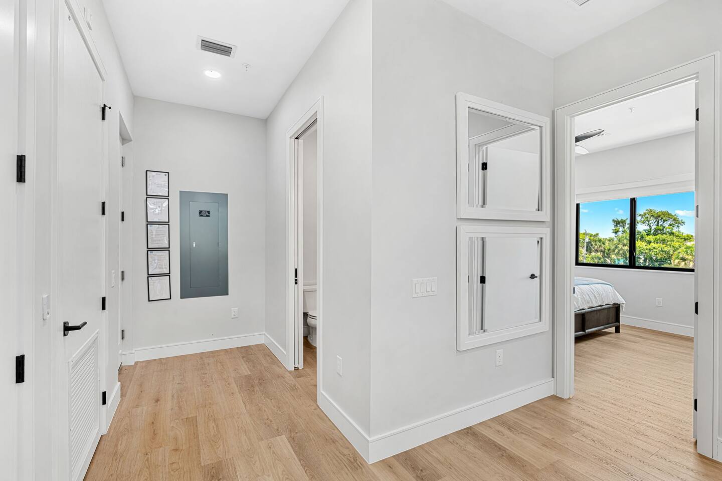 A bright hallway with an easy flow into the bedroom.