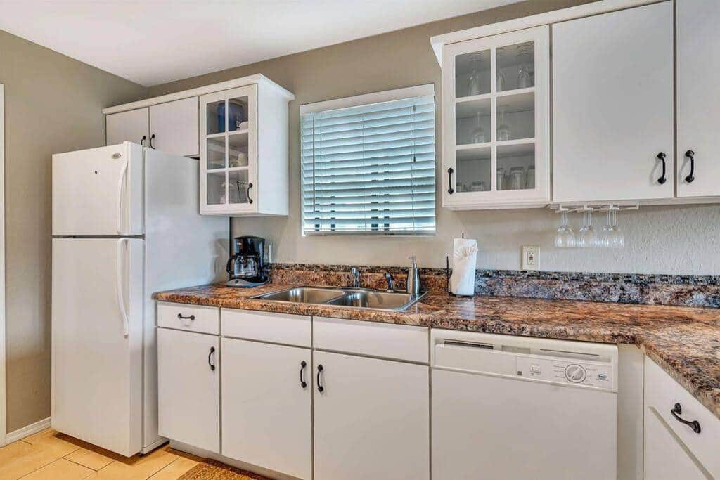 Kitchen with full size fridge and dishwasher