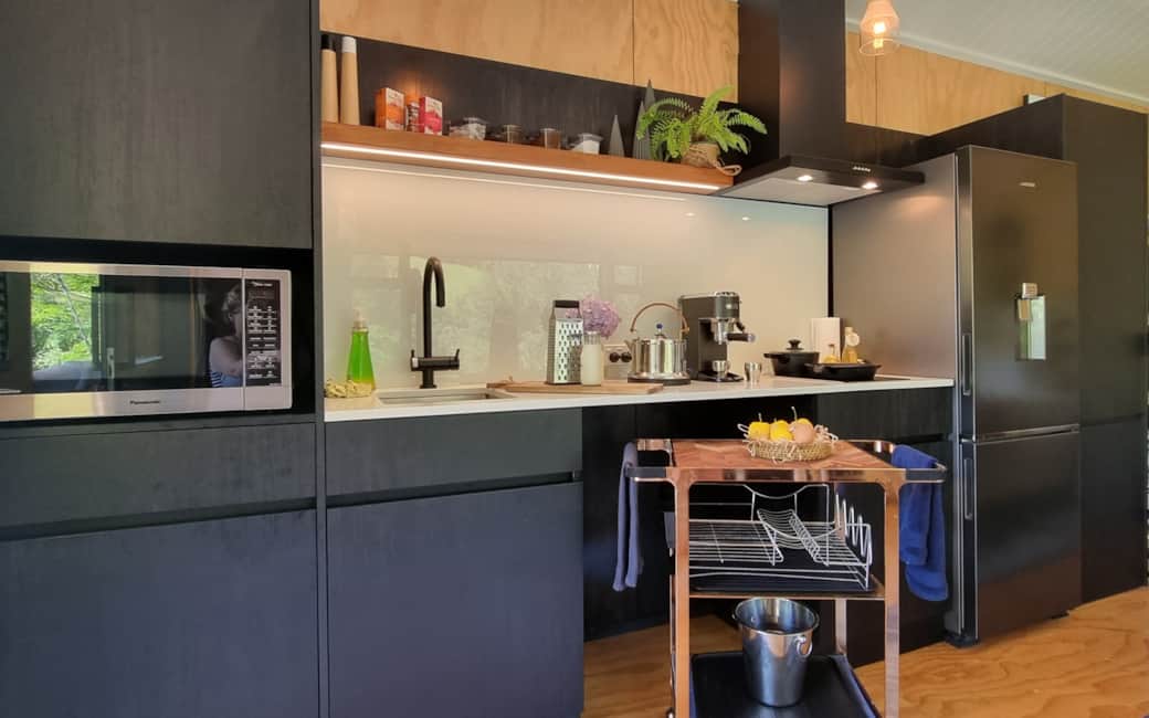 Designer kitchen with modern appliances at River Song Cabin Ripples Retreat Waitomo NZ