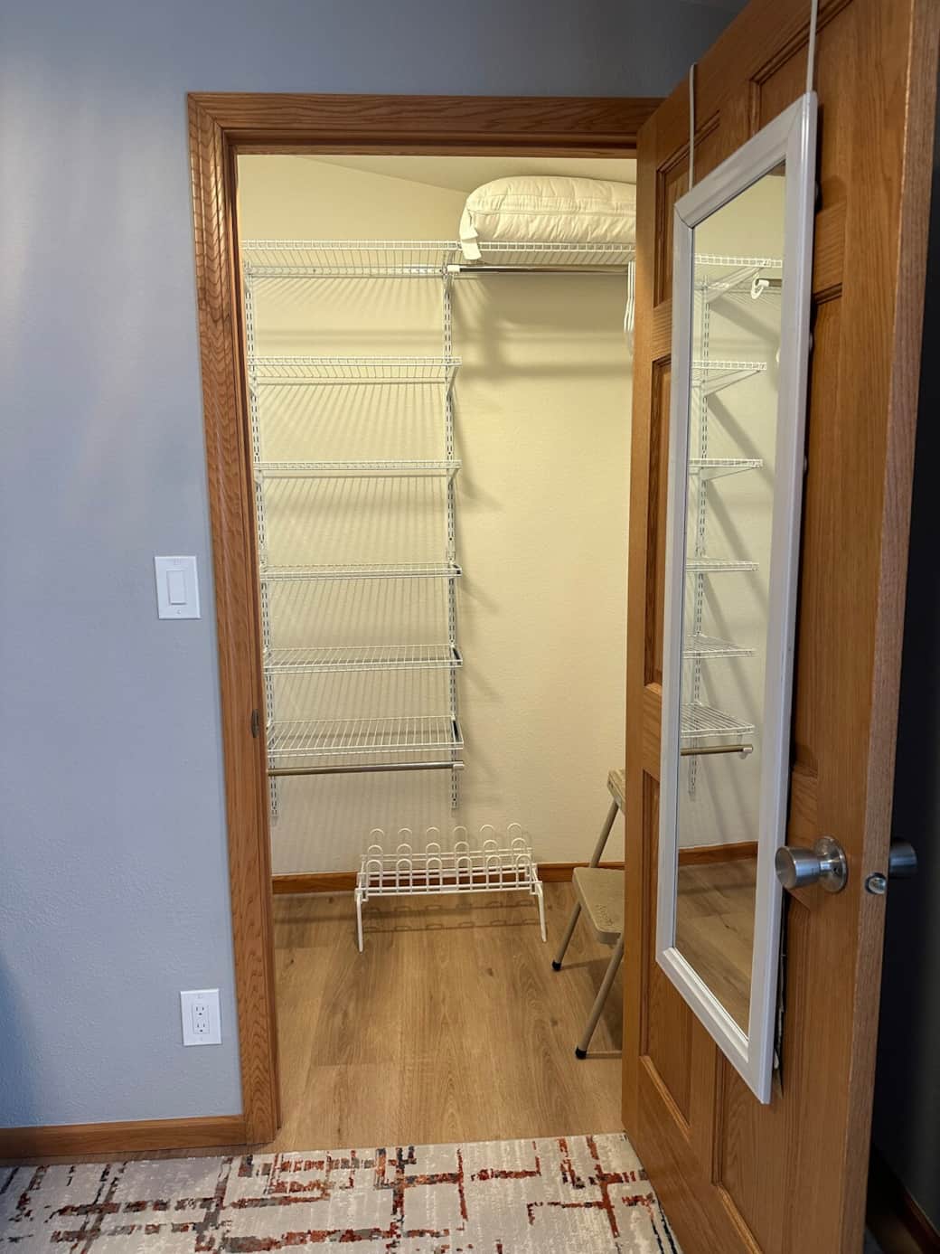 Master closet with full length mirror, shoe rack, step ladder & shelves