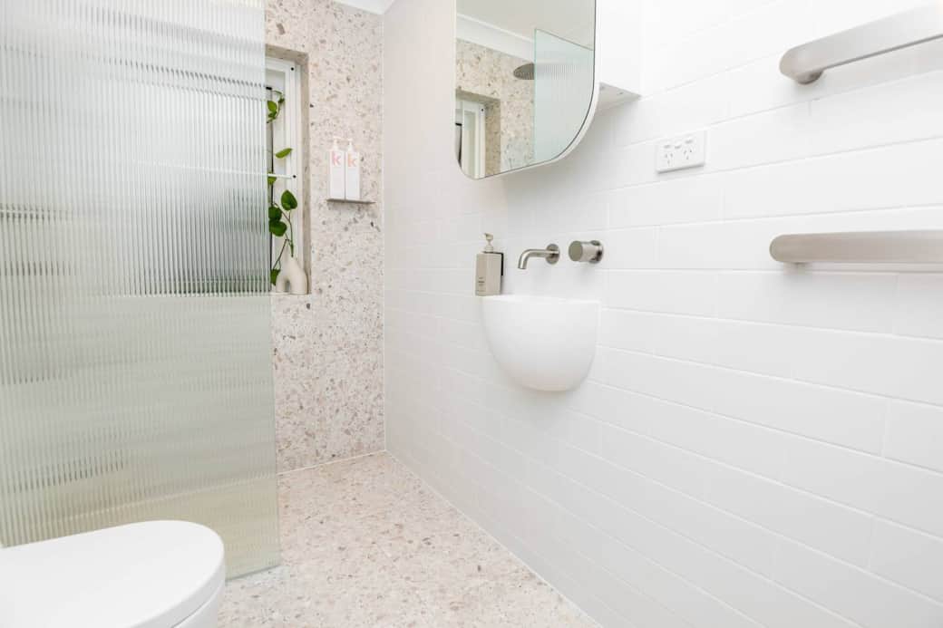 Experience our exquisite new Terrazzo bathroom, adorned with top-tier finishes and luxurious products. 

Plus, you'll find the convenience of a washing machine in the same space for your added comfort and convenience during your stay.