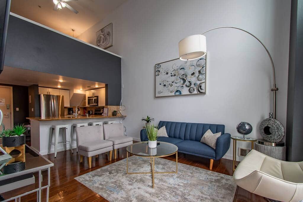 Living Room with a Large TV, Vaulted Ceiling Windows & Sleeper Sofa