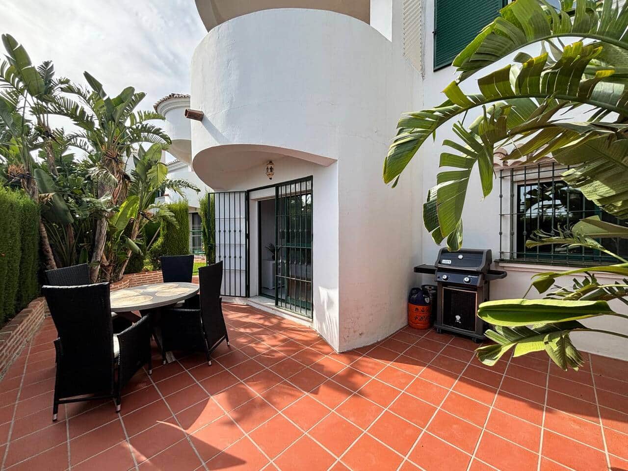 BBQ area surrounded by lush Mediterranean greenery.