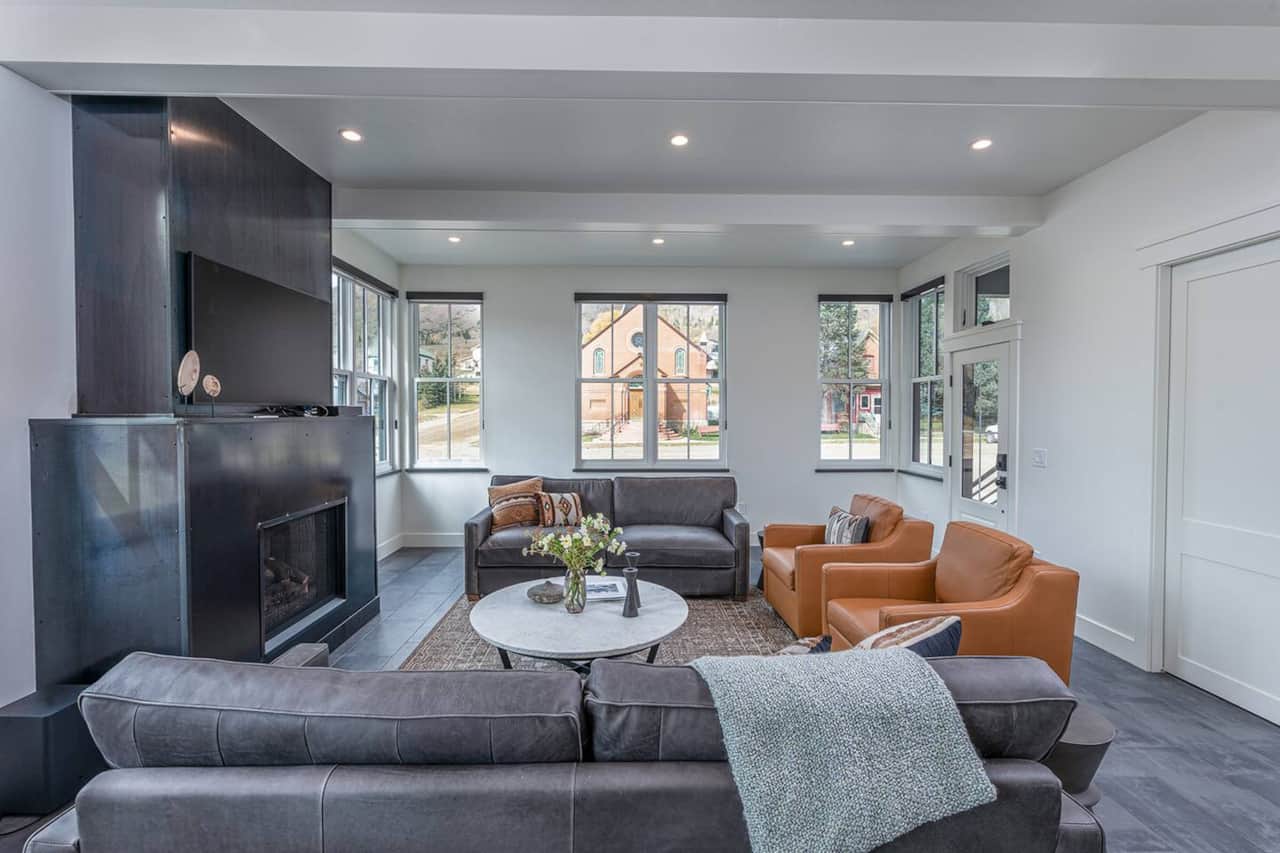 Living room in a luxury Silverton vacation rental with gas fireplace & mountain views