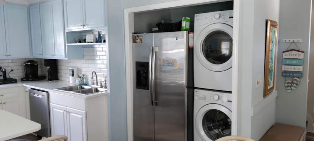 Kitchen with refrigerator, washer-dryer
