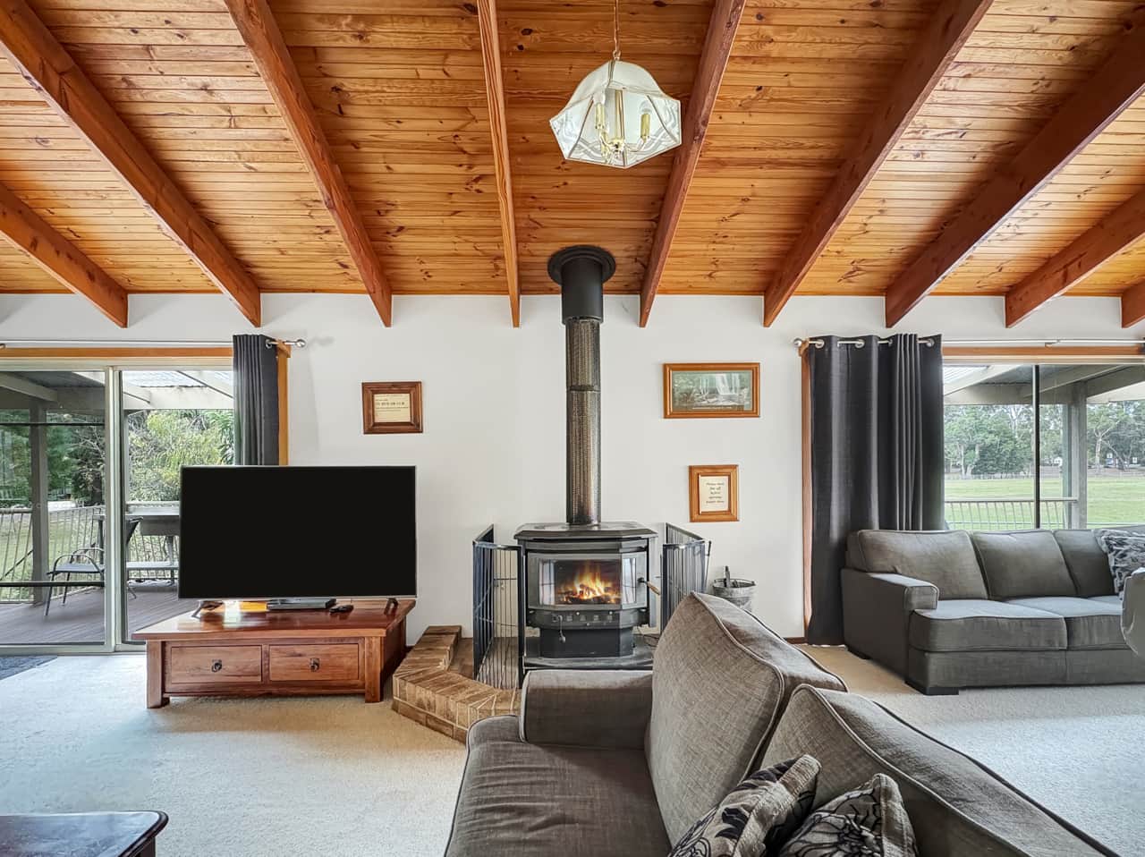 Enjoy the cozy living area with a wood fire, ideal for both warmth and ambiance.  Complete with Smar