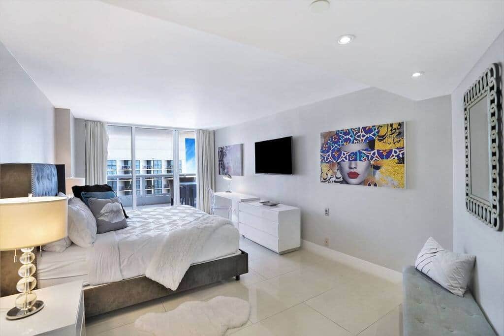 Master bedroom, king bed, Tv, balcony access, desk, walk in closet, master bathroom