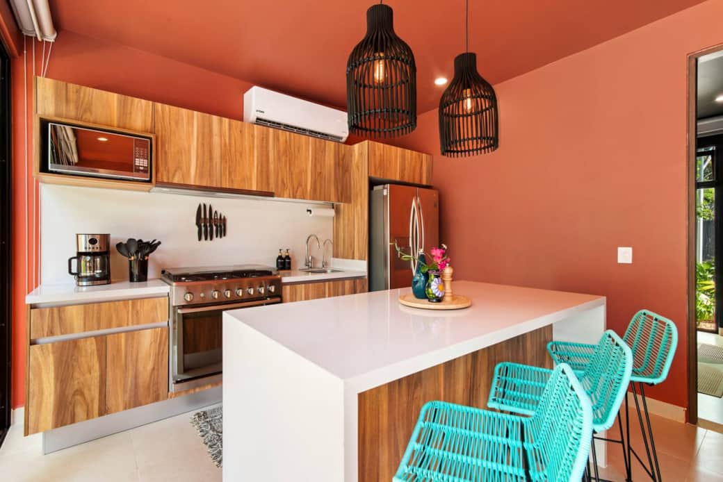 Fully equipped kitchen with filtered drinking water and ice, plus dishwasher, microwave, coffee maker (with coffee), blender, toaster, full-size fridge, stove, and oven—everything you need to make a meal and enjoy it at home.