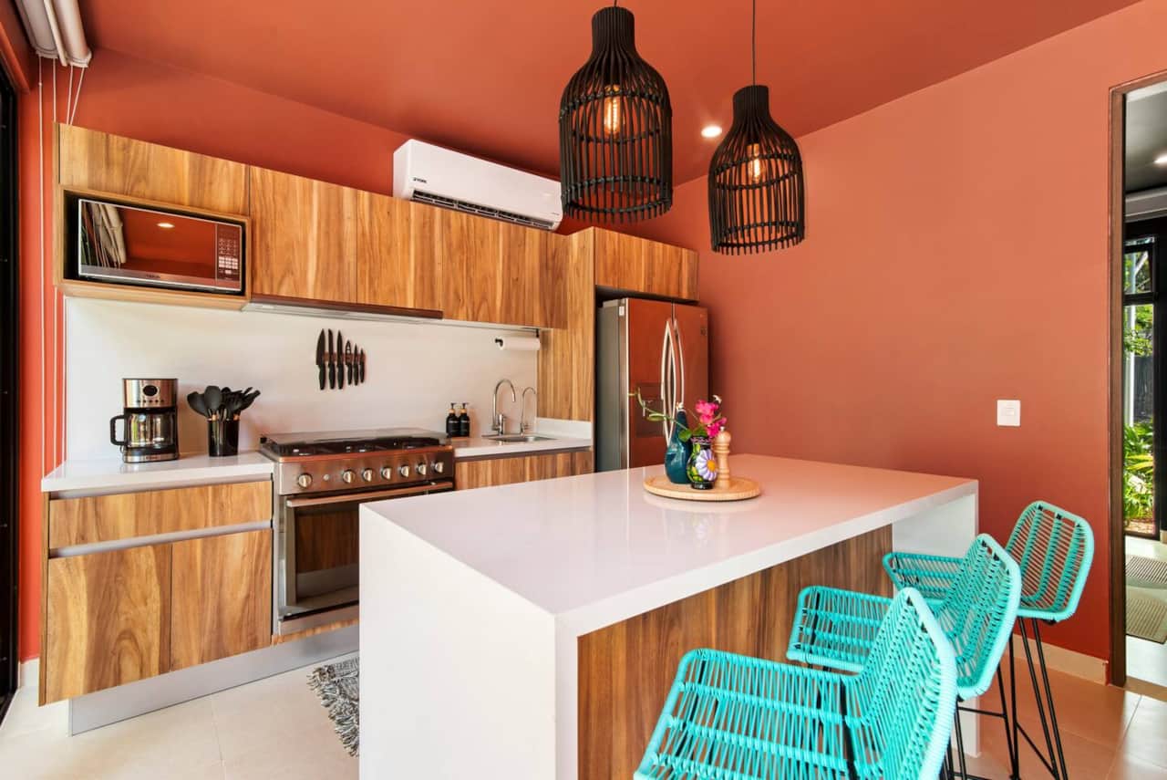 Fully equipped kitchen with filtered drinking water and ice, plus dishwasher, microwave, coffee maker (with coffee), blender, toaster, full-size fridge, stove, and oven—everything you need to make a meal and enjoy it at home.